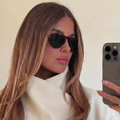 Model wearing Ciren oval tortoiseshell sunglasses, selfie
